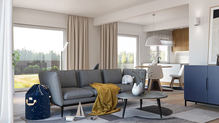 großes graues Sofa und helle Vorhänge